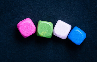 Top view of colorful square beads with copy space