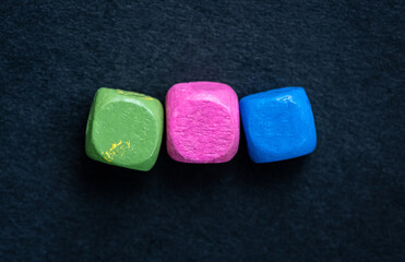 Close up view of bright cubes on dark blue background
