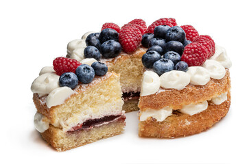 Victoria sponge cake with whipped cream and berries on top isolated on white