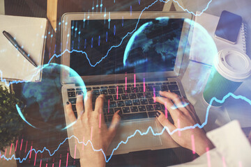 Double exposure of woman hands typing on computer and forex chart hologram drawing. Stock market invest concept.