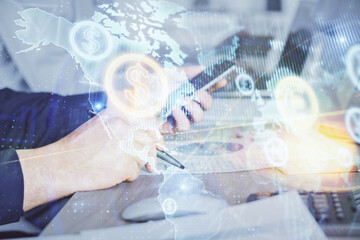 Double exposure of man's hands holding and using a digital device and forex graph drawing. Financial market concept.