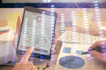 Multi exposure of man's hands holding and using a phone and financial chart drawing. Market analysis concept.