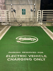 Parking space for electric vehicles only in a parking garage. - 375969923