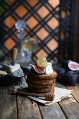 fig with Camembert cheese and honey.   Wine and cheese still life.