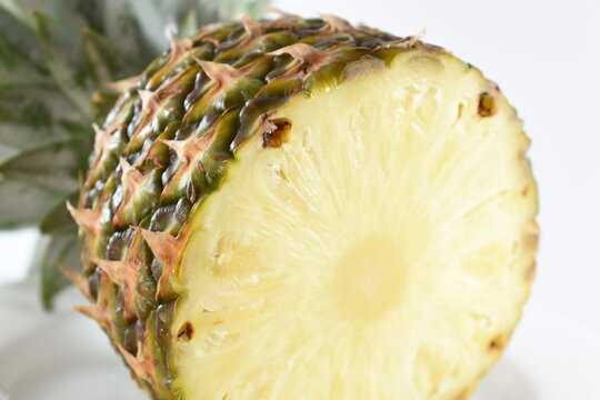 
beautiful view of a yellow pineapple with white background