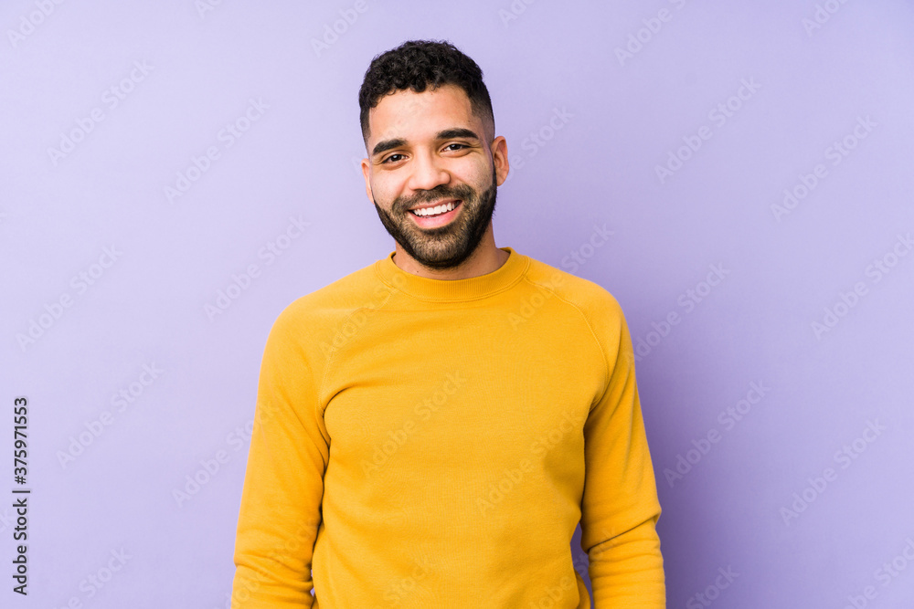 Wall mural Young mixed race arabic man isolated happy, smiling and cheerful.