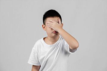 Asian boys studio portrait on gray background