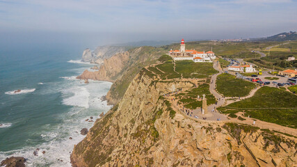 Fototapeta na wymiar Aerial view of Cabo da Roca, Portugal. Lighthouse and cliff by the sea on the Portuguese coast