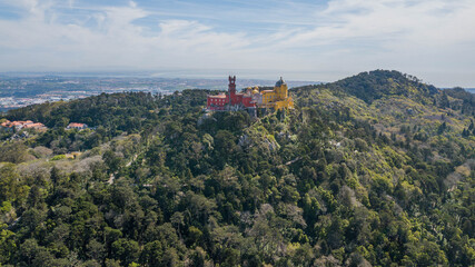 Fototapeta na wymiar Aerial view of the Pena National Palace, Sintra, Portugal. beautiful castle on top of the mountain
