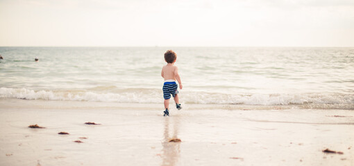 little boy running on the beach in Marco island florida 