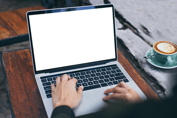 computer mockup blank screen.hand woman work using laptop with white background for advertising,contact business search information on desk at coffee shop.marketing and creative design