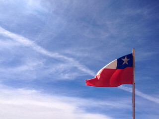 flag blue sky clouds red