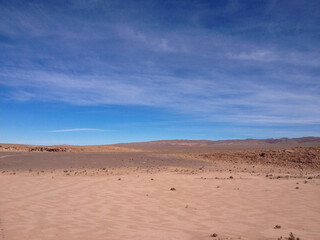 Fototapeta na wymiar desert sand blue sky clouds