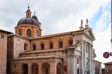 Fototapeta premium View of the facade and the cupola of the neoclassical Duomo di Urbino, Urbino Cathedral in the Marche, Italy.