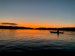 Kayaking During Sunset on Lake 