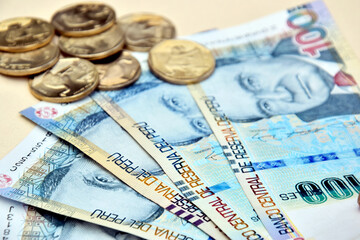 Peruvian Banknotes with coins