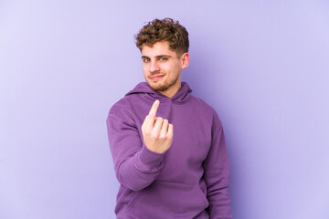 Young blond curly hair caucasian man isolated pointing with finger at you as if inviting come closer.