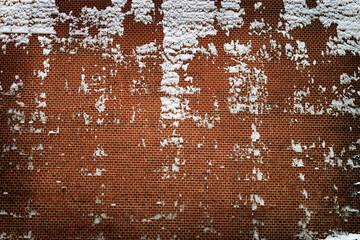 Red brick wall texture grunge background with vignetted, brickwall with snow on side. Building block facade.