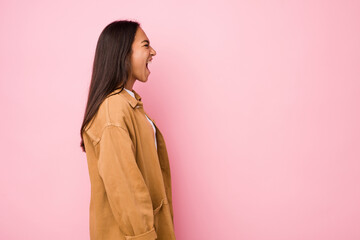 Fototapeta premium Young mixed race indian woman isolated shouting towards a copy space