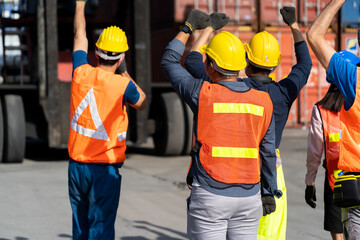 Strike of workers in container yard. Group of multiethnic engineer people during a protest in workplace