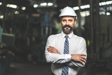Man at work. Mechanical Engineer Bearded man in Hard Hat  in Heavy Industry Manufacturing Facility. Professional Engineer Operating lathe Machinery