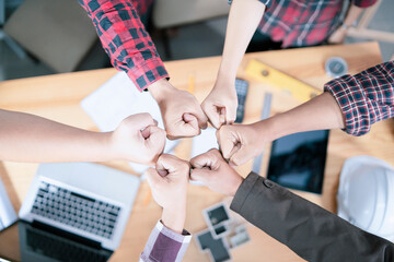 Teamwork concept,Business team standing hands together in office.people joining for cooperation success business,Shaking hands of engineering partnership agreement of Architect engineer  contractor