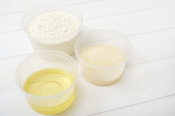 flour, vegetable oil and sugar in a plastic bowl