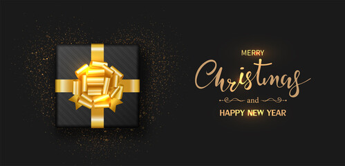 Christmas banner. Gift box decorated with gold bow-ribbon isolated on black background. Vector illustration.