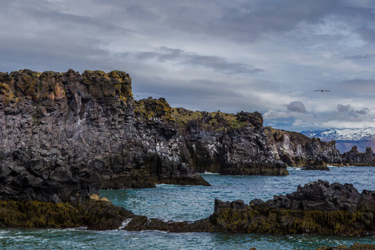 The volcanic black basalt landscape at the coast of Hellnar, a small town in Snaefellsnes, Iceland.