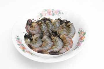 Fresh shrimp on a white plate.