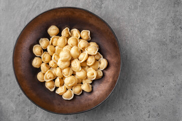 Plate with dumplings called pelmeni made from dough with meat or vegetable filling and boiled
