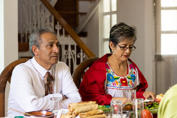 Fototapeta na wymiar A married couple enjoy a traditional Mexican dinner