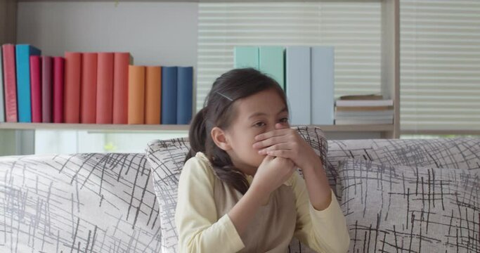 Asian cute girl close her nose because bad smell