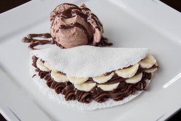 banana tapioca with chocolate ice cream on a white dish