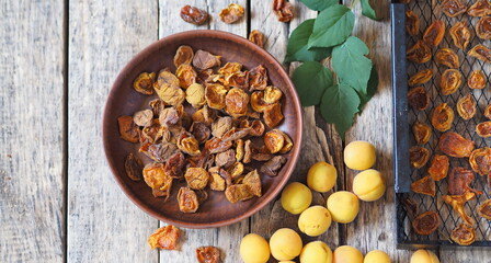 Procurement of dried apricots for future use.Dried apricots in a rack from the dryer with fresh...