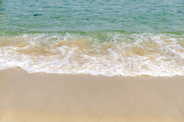 Fototapeta na wymiar Beautiful teal blue wave on the California coast.