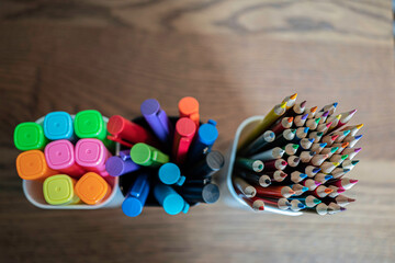 Collection of colored Pencils, pens and highligters in pen holders