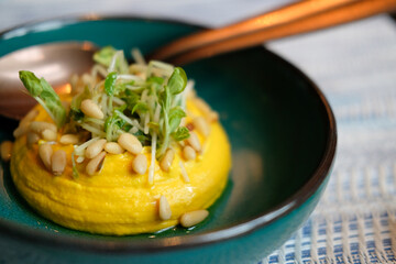 pumpkin hummus with pea sprout. vegetarian middle eastern appetizer food