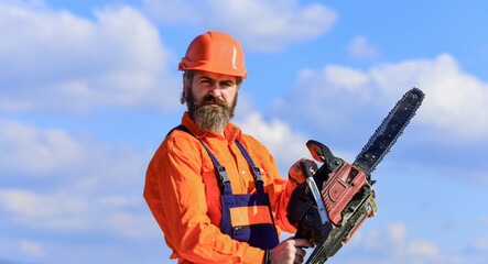 Ready for challenges. Man builder chainsaw. Handyman workshop. Creativity and practice. Craftsman...