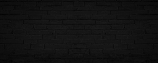 Fototapeta na wymiar Abstract Black Brick Wall Texture Background. Weathered Brickwork Design Backdrop. Wide Panorama Picture.