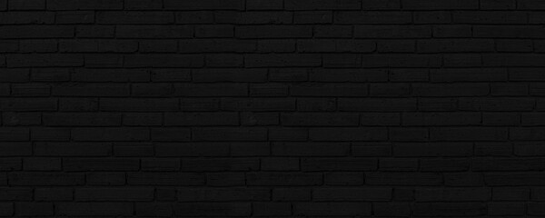 Fototapeta na wymiar Abstract Black Brick Wall Texture Background. Weathered Brickwork Design Backdrop. Wide Panorama Picture.