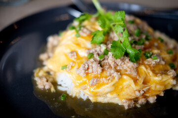 Scrambled eggs minced pork on top hot steam rice