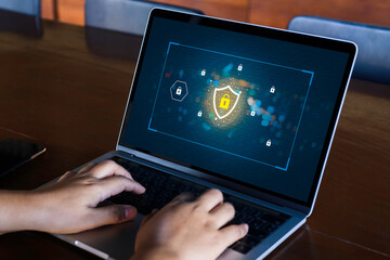 Businesswoman hand using laptop with Data protection, Cyber security secure, information safety and...