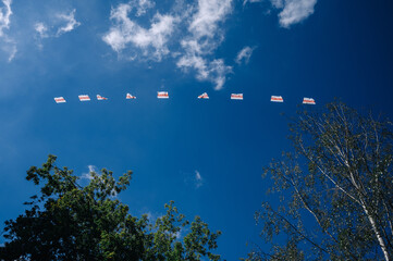 Many Belarusian white-red-white flags are flying in the skies over Minsk, Belarus. This flag is used by the opposition in the fight against the Lukashenka regime.
