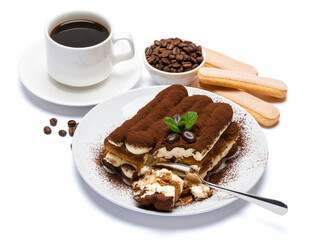 portion of Classic tiramisu dessert, savoiardi cookies and cup of fresh espresso coffee isolated on white background with clipping path
