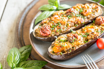 Baked eggplant. aubergine stuffed with vegetables and cheese