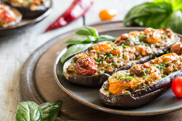 Baked eggplant. aubergine stuffed with vegetables and cheese