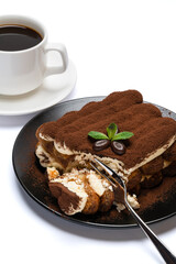 portion of Classic tiramisu dessert and cup of fresh espresso coffee isolated on white background with clipping path