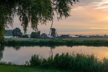 Sunrise over the meadows of the Zwanburgerpolder at the Kagerplassen in the South-Holland village of Warmond in the Netherlands.
