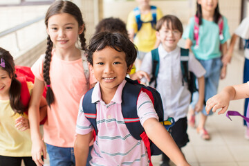 happy Group of elementary school kids running forward